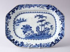 AN 18TH CENTURY CHINESE BLUE & WHITE PORCELAIN SERVING DISH, decorated with a native landscape view,