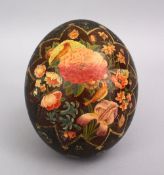A GOOD 19TH CENTURY PERSIAN PAINTED OSTRICH EGG, decorate with scenes of floral display, 16cm.