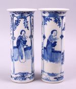 A PAIR OF CHINESE KANGXI BLUE & WHITE PORCELAIN SLEEVE VASES, both decorated with scenes of