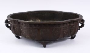 A GOOD 19TH CENTURY CHINESE BRONZE MOULDED TIN HANDLE CENSOR, with carved formal motif design with