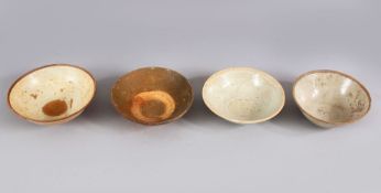 A LOT OF FOUR EARLY CHINESE POTTERY BOWLS, some glazed some unglazed. largest: 16cm diameter.