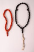 TWO ISLAMIC PRAYER / ROSARY BEADS, possibly Bakelite, 26cm & 31cm.