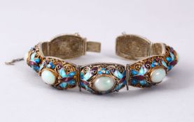 A GOOD CHINESE 19TH CENTURY GILT SILVER FILIGREE, ENAMEL AND WHITE JADE BRACELET, 19cm open.