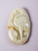 A GOOD CHINESE PALE CELADON JADE CARVED PENDANT OF A CRANE, 6cm.