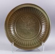 A FINE QUALITY CHINESE YUAN DYNASTY CELADON PEONY CHARGER, the central section with a raised moulded