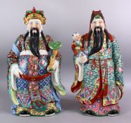 A LARGE PAIR OF 20TH CENTURY CHINESE FAMILLE ROSE IMMORTAL FIGURES, one holding a scepter, the other