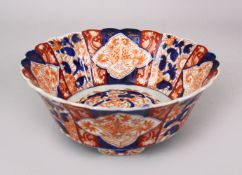 A GOOD JAPANESE MEIJI PERIOD IMARI TRIPLE FOOT MOULDED PORCELAIN BOWL, the bowl decorated with