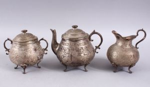 A GOOD 19TH CENTURY PERSIAN SILVER TEA SET, comprising a tea pot, 14cm high x 16cm wide, a cream jug