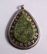 A GOOD ISLAMIC CARVED JADE SEAL & WHITE METAL PENDANT, the jade carved with calligraphy and fixed to