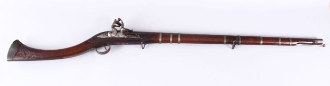 A 19TH CENTURY PERSIAN RIFLE WITH AN EARLY OTTOMAN WATERED STEEL BARREL, 120cm