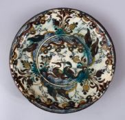 A GOOD PERSIAN SAFAVID DYNASTY KUBACHI POTTERY DISH, the dish with two ducks seated amongst an array