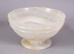A 19TH CENTURY CHINESE CARVED WHITE AGATE STEM BOWL, 10cm.