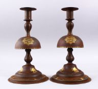 A FINE PAIR OF QAJAR STEEL AND GOLD INLAID CANDLESTICKS, the inlay of calligraphy and the qajar