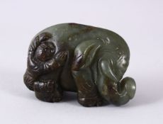A GOOD 19TH CENTURY CHINESE CARVED JADE BOY & ELEPHANT FIGURE, the boy stood climbing upon or