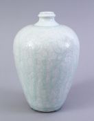 A GOOD SOUTH SONG STYLE CARVED CELADON MEIPING VASE, the body carved with scrolling floral design,