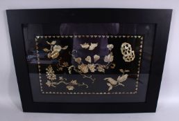 A GOOD 19TH / 20TH CENTURY CHINESE MOTHER OF PEARL INLAID LACQUER PANEL, carved depicting flora