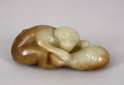 A CHINESE CARVED JADE FIGURE OF A MONKEY UPON A GOURD, 10CM