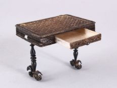 A FINE ISLAMIC SILVER FILIGREE MINIATURE TABLE, with a drawer, 5.5 x 6.5