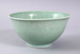 A GOOD CHINESE CELADON GLAZED PORCELAIN BOWL, the base bearing a six character mark, 11cm.