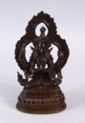 A GOOD CHINESE / TIBETAN BRONZE FIGURE OF A MULTI ARM DEITY, seated upon a lotus base , the arms