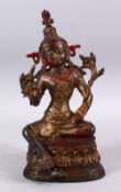 A LARGE TIBETAN GILT BRONZE FIGURE OF A SEATED GODDESS 