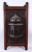 A GOOD ISLAMIC 19TH CENTURY CARVED WOODEN WALL HANGING, in the form of a balcony, in laid with brass