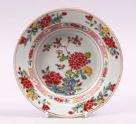 AN 18TH CENTURY CHINESE FAMILLE ROSE PORCELAIN SAUCER DISH, with floral decoration, 16cm.