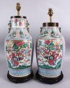 A GOOD PAIR OF 19TH CENTURY CANTON CHINESE FAMILLE ROSE PORCELAIN VASES, the body with a pink ground