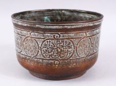 A 16TH CENTURY MAMLUK ENGRAVED COPPER CALLIGRAPHIC BOWL, 17.5cm diameter.