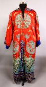 A FINE 19TH CENTURY CHINESE EMBROIDERED SILK DRAGON COURT ROBE, the silk of red ground with