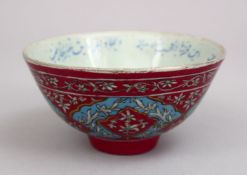 A GOOD 19TH CENTURY QAJAR FAMILLE ROSE PORCELAIN BOWL, with a pink ground and turquoise border