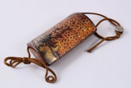 A JAPANESE MEIJI PERIOD LACQUER FOUR CASE INRO, with a white metal seal bead, decorated with a