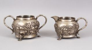 TWO 19TH CENTURY INDIAN CALCUTTA SILVER TEA SET ITEMS, sugar bowl and cream jug, with embossed