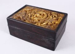 A GOOD CHINESE HARDWOOD & CARVED JADE LIDDED BOX, the jade insert carved with figures and dragons in
