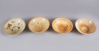 A LOT OF FOUR EARLY CHINESE POTTERY BOWLS, some glazed some unglazed. largest: 15.5cm diameter