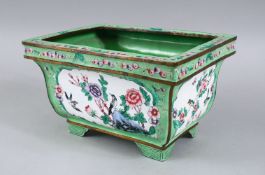 A GOOD 19TH / 20TH CENTURY CHINESE APPLE GREEN ENAMELLED PLANTER, decorated with panels depicting