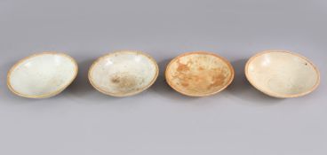 A LOT OF FOUR EARLY CHINESE POTTERY BOWLS, some glazed some unglazed. largest: 15cm diameter.