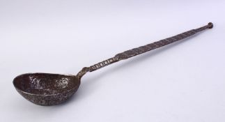 A 12TH/13TH CENTURY PERSIAN SELJUK ENGRAVED IRON LADLE, with foliate and figural decoration, 48cm