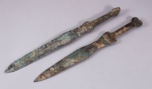 TWO GOOD ISLAMIC BRONZE SWORDS, 36CM & 38CM.