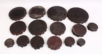 A MIXED LOT OF 19TH CENTURY CHINESE CARVED HARDWOOD STANDS, comprising of fifteen various shaped and