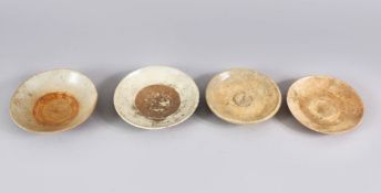 A LOT OF FOUR EARLY CHINESE POTTERY BOWLS, some glazed some unglazed. largest: 15cm diameter.