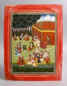 AN INDIAN MUGHAL MINIATURE PAINTING OF FIGURES SEATED IN A GARDEN, 31CM X 24CM