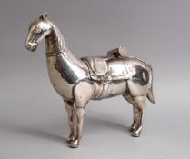 A FINE 19TH CENTURY COLONIAL OR SOUTH AMERICAN SOLID SILVER MODEL OF A HORSE, 26CM WIDE X 22 HIGH