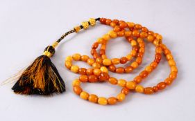 A FINE SET OF CHINESE QING DYNASTY CARVED AMBER PRAYER / ROSARY BEADS, comprising 102 oblong