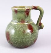 A CHINESE CELADON GLAZED POTTERY JUG FOR THE PERSIAN MARKET, with a moulded animal form handle, 15cm