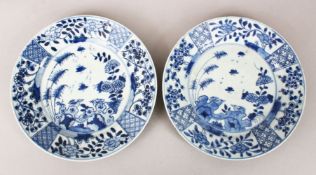 A GOOD PAIR OF 18TH CENTURY CHINESE BLUE & WHITE PORCELAIN PLATES, each with panel decoration
