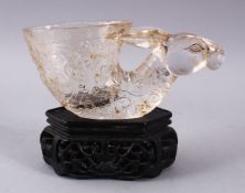 A CHINESE CARVED GLASS / CRYSTAL DEER HEAD LIBATION CUP & STAND, the cup carved with the head of a