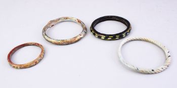 FOUR GOOD MAMLUK CARVED STONE / GLASS BRACELETS. largest 9cm.