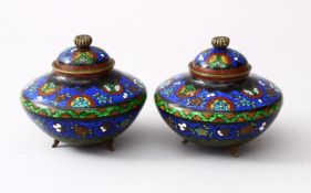 A PAIR OF 19TH / 20TH CENTURY CHINESE CLOISONNE LIDDED KORO, the body of the koro's decorated with a