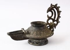 AN EARLY ISLAMIC POSSIBLY ANDALUSIAN SPANISH BRONZE OIL LAMP, 16CM